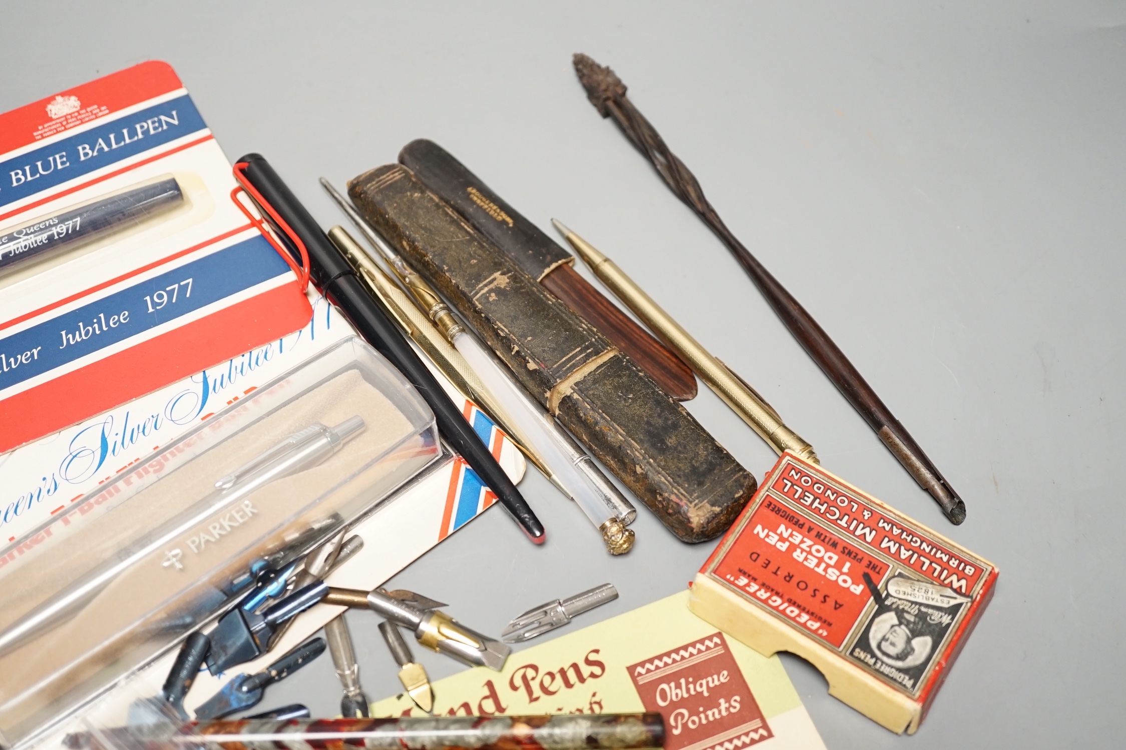 A silver Tiffany dip pen, assorted writing equipment and quill knives